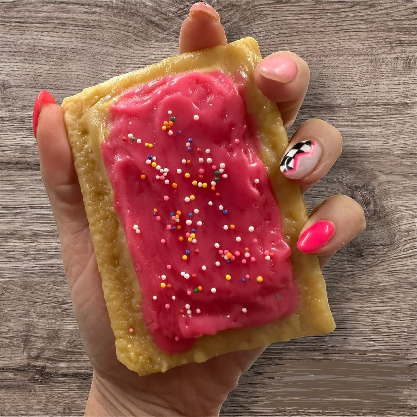 Doodlations Coffee Bar & Boutique PopTart wax melt with pink frosting and colorful sprinkles.