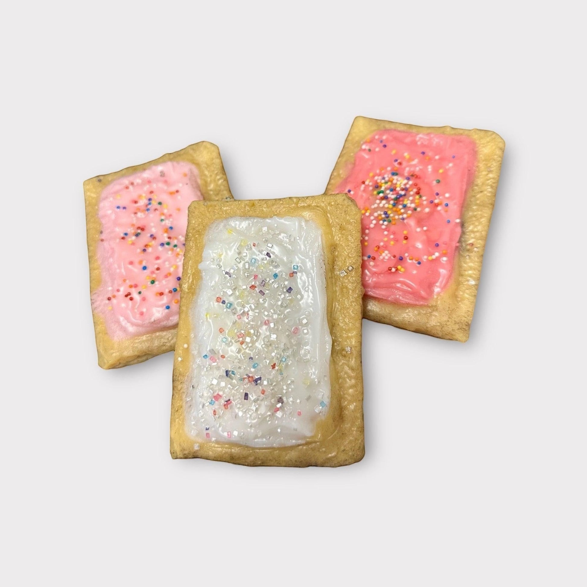 Doodlations Coffee Bar & Boutique PopTart wax melts in pink and white frosting with colorful sprinkles.