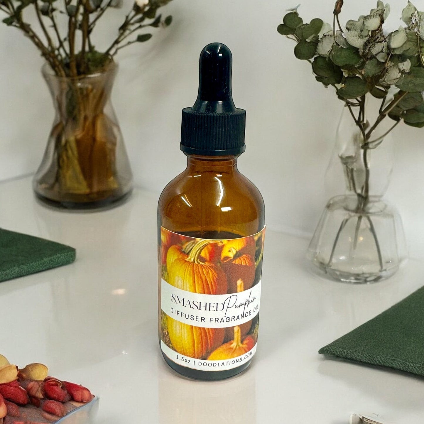 Doodlations Coffee Bar & Boutique Smashed Pumpkin fragrance oil in amber glass bottle with dropper. Autumnal pumpkin label.