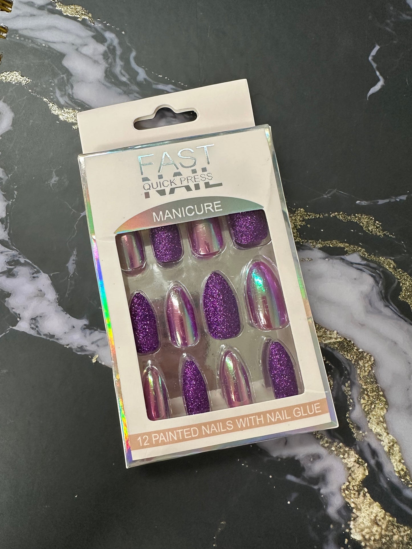 Doodlations Coffee Bar & Boutique Fast Nails Quick Press Manicure set featuring 12 purple glitter and chrome almond-shaped press-on nails.