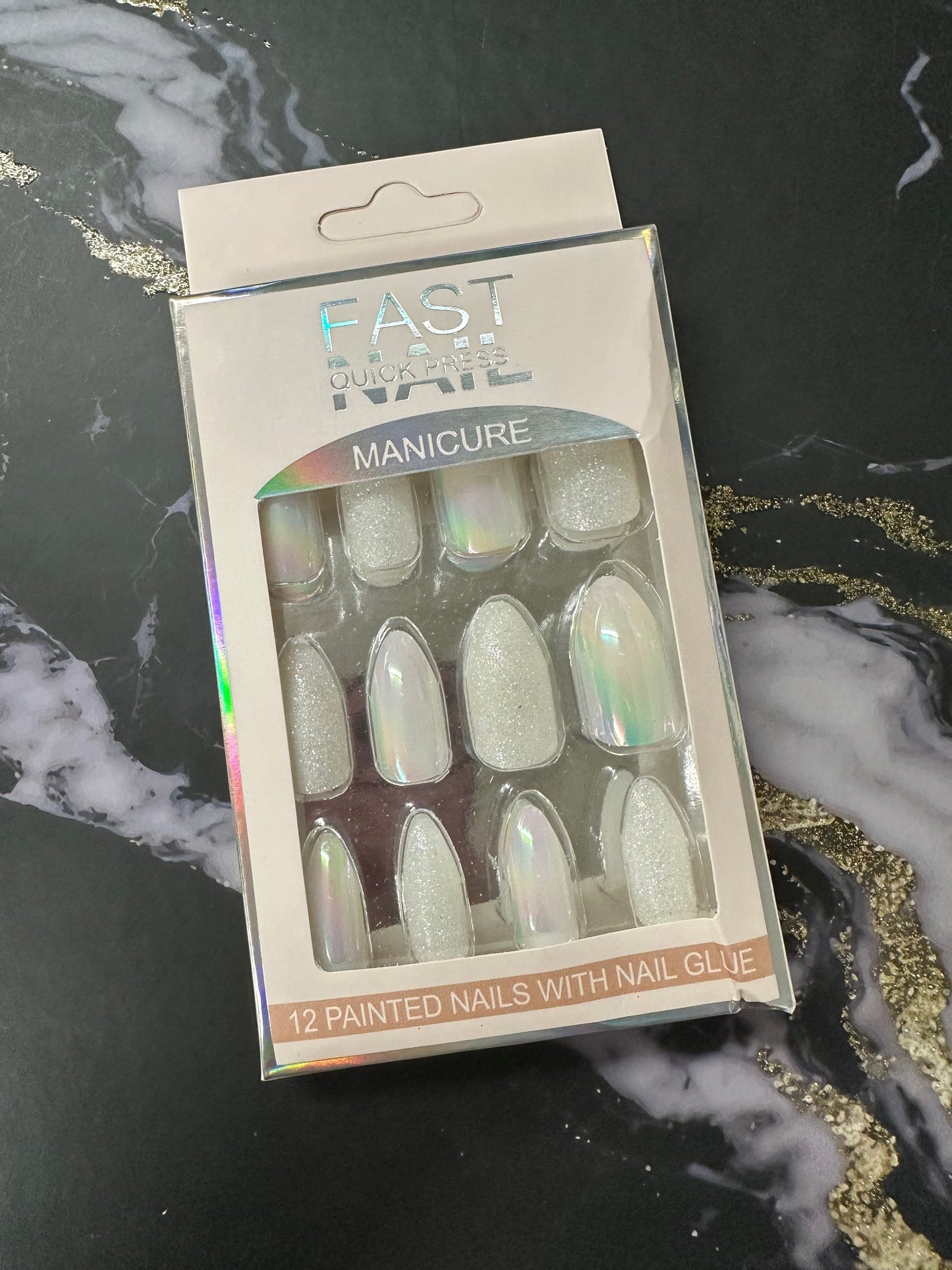 Doodlations Coffee Bar & Boutique Fast Nails Quick Press Manicure set featuring 12 white iridescent and glitter press-on nails.