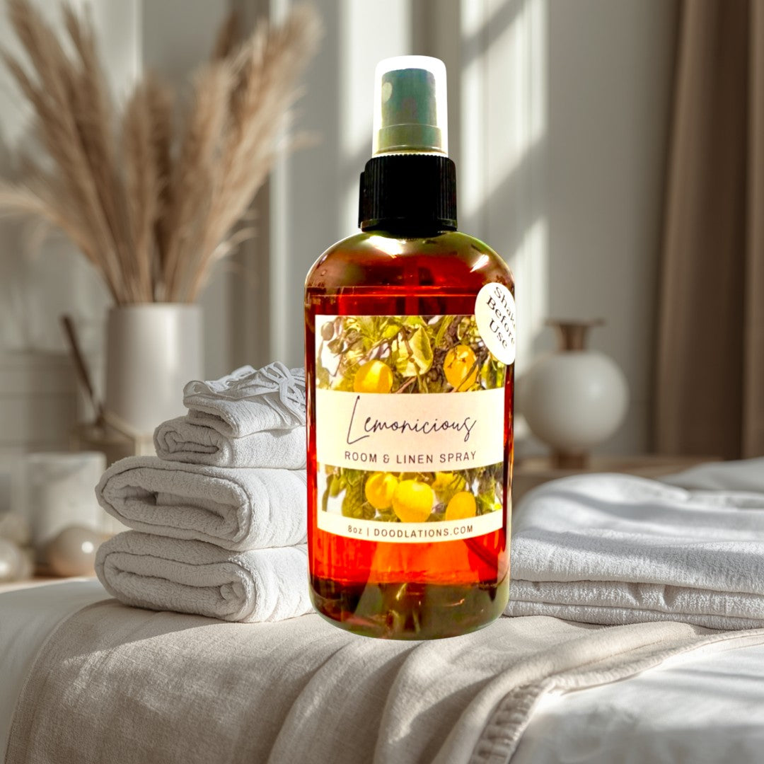 Doodlations Lemonicious room and linen spray in amber bottle with citrus label. Refreshing scent.