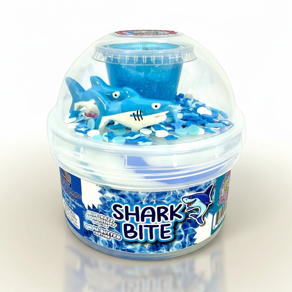 Doodlations Coffee Bar & Boutique Shark Bite slime with blue glitter, shark toy, and ocean-themed charms.