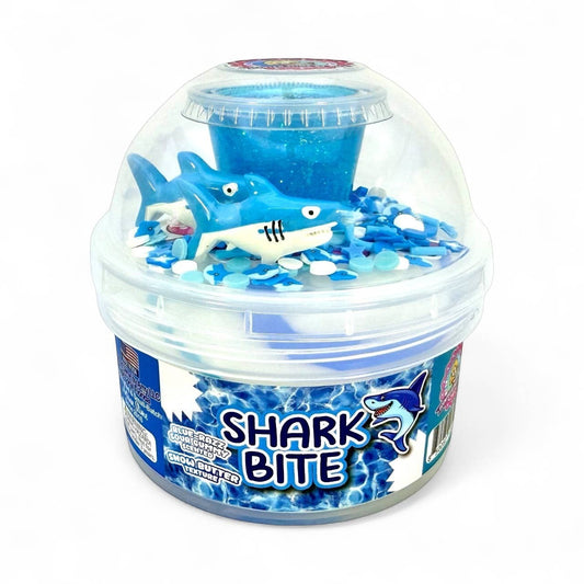 Doodlations Coffee Bar & Boutique Shark Bite Slime container with blue glittery slime, shark figure, and shark charms.