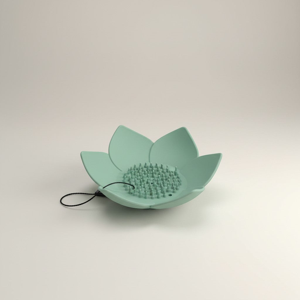 Doodlations Coffee Bar & Boutique mint green silicone lotus flower shower steamer holder with hanging loop.