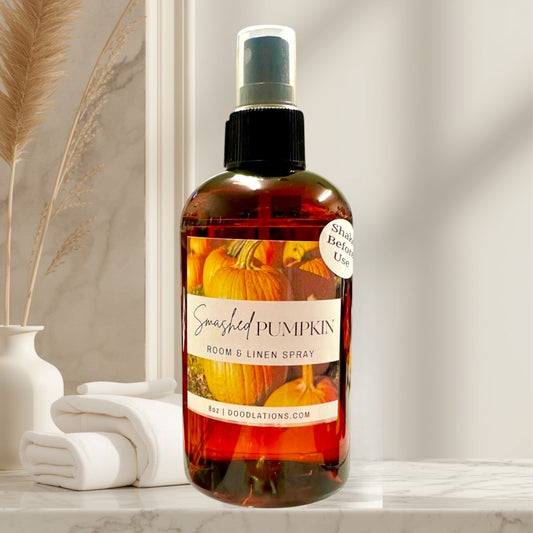 Doodlations Coffee Bar & Boutique Smashed Pumpkin Room & Linen Spray, an 8oz amber bottle with a pumpkin label.