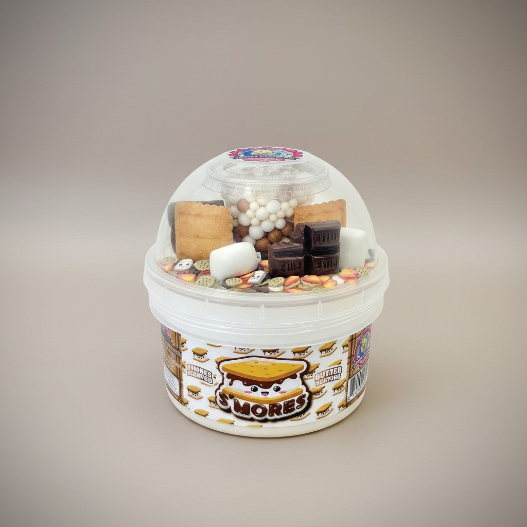 Doodlations S'mores Slime bucket with graham cracker, marshmallow, and chocolate charms. Campfire background.