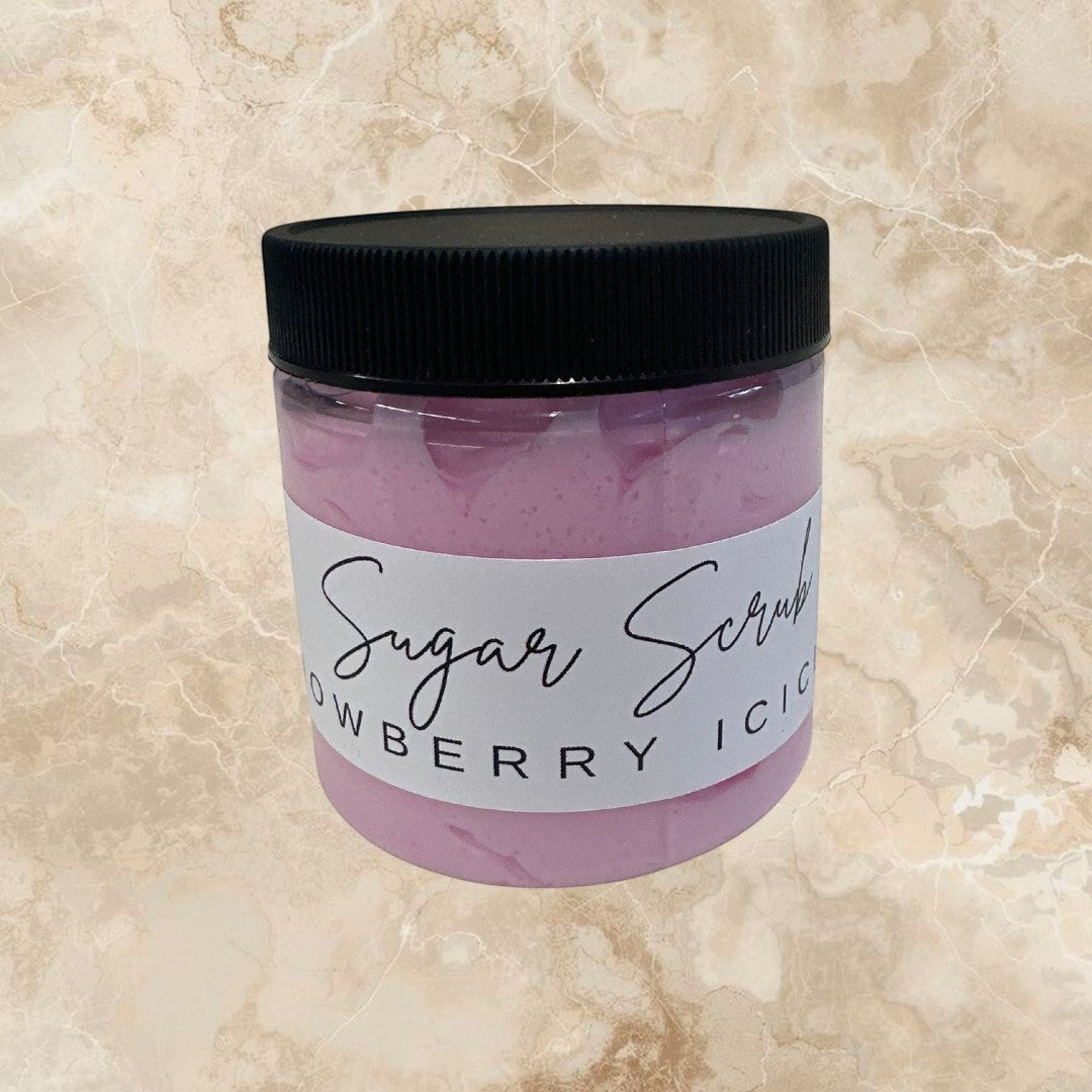 Doodlations Snowberry Icicles sugar scrub in a clear jar with a black lid. Pink exfoliating body scrub.
