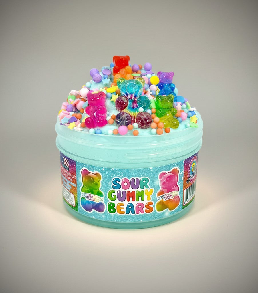 Doodlations Coffee Bar & Boutique Sour Gummy Bears cloud dough slime in a teal tub, topped with colorful gummy bear charms and sprinkles.