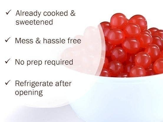 Doodlations Coffee Bar & Boutique strawberry bursting balls in a white bowl, perfect for drinks and desserts.
