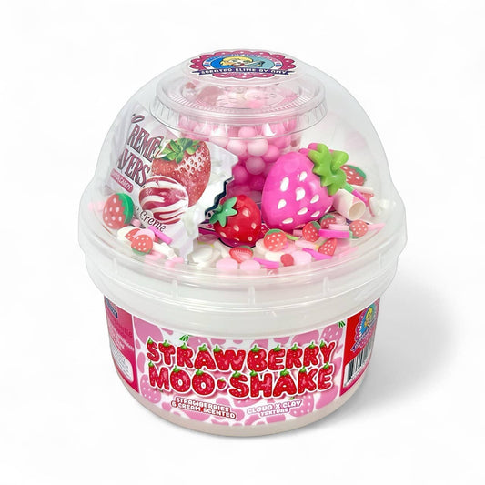 Doodlations Strawberry Moo Shake cloud clay slime with pink and white swirls, strawberry charms, and sprinkles.