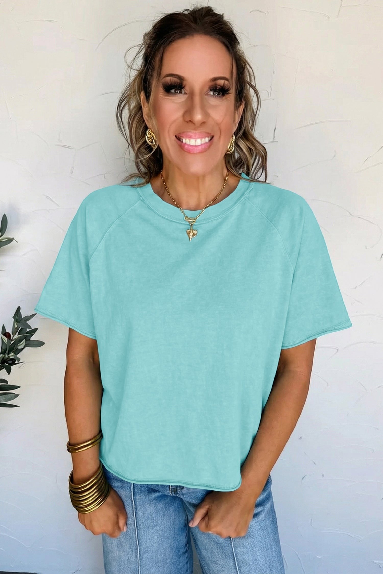 Doodlations Coffee Bar & Boutique teal mineral wash cotton blend tee with raw hem and sleeves.