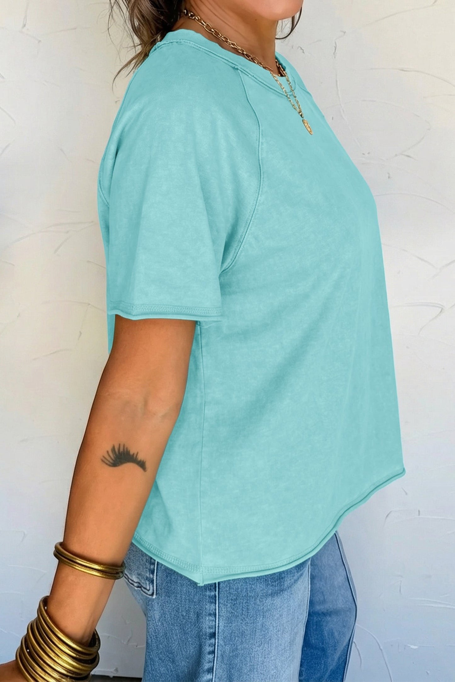 Doodlations Coffee Bar & Boutique teal mineral wash cotton blend tee with raw edge hem and sleeves.