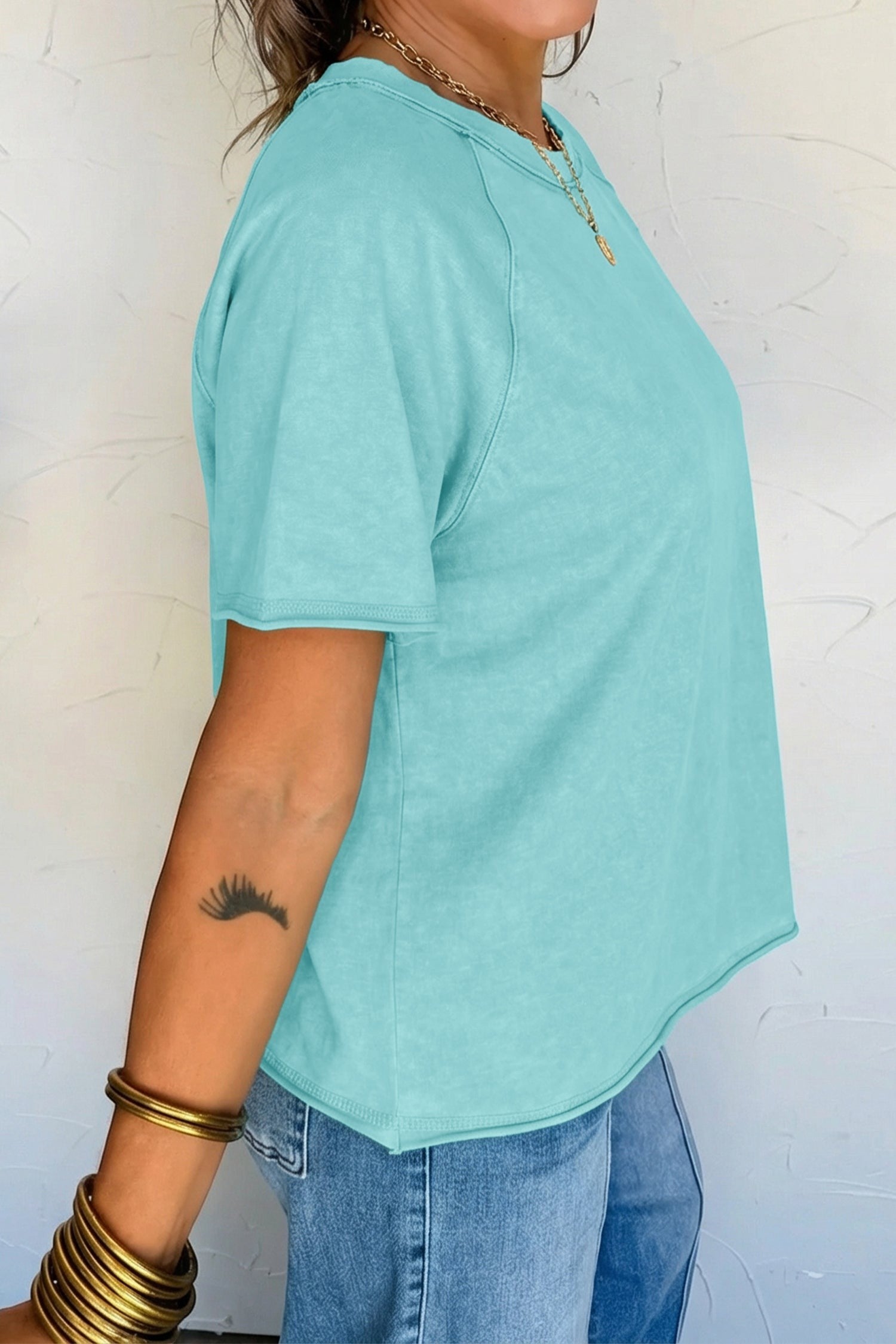 Doodlations Coffee Bar & Boutique teal mineral wash cotton blend tee with raw edge hem and sleeves.
