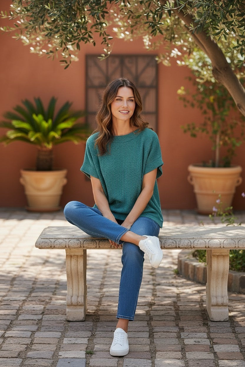 Doodlations Coffee Bar & Boutique teal textured knit relaxed fit short sleeve crew neck top.