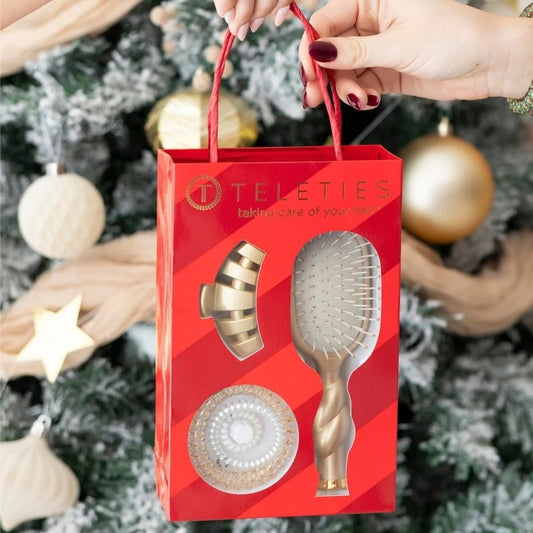 Doodlations Coffee Bar & Boutique Teleties gold mini hair brush and claw clip gift set in a red striped box.