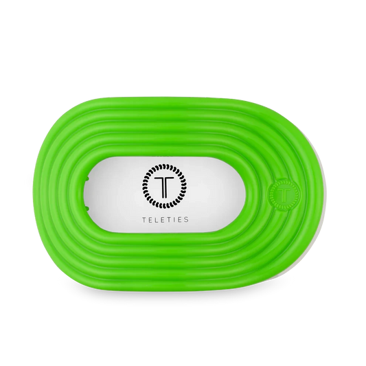 Doodlations Coffee Bar & Boutique Teleties Glow For It flat round lime green hair clip with T logo.