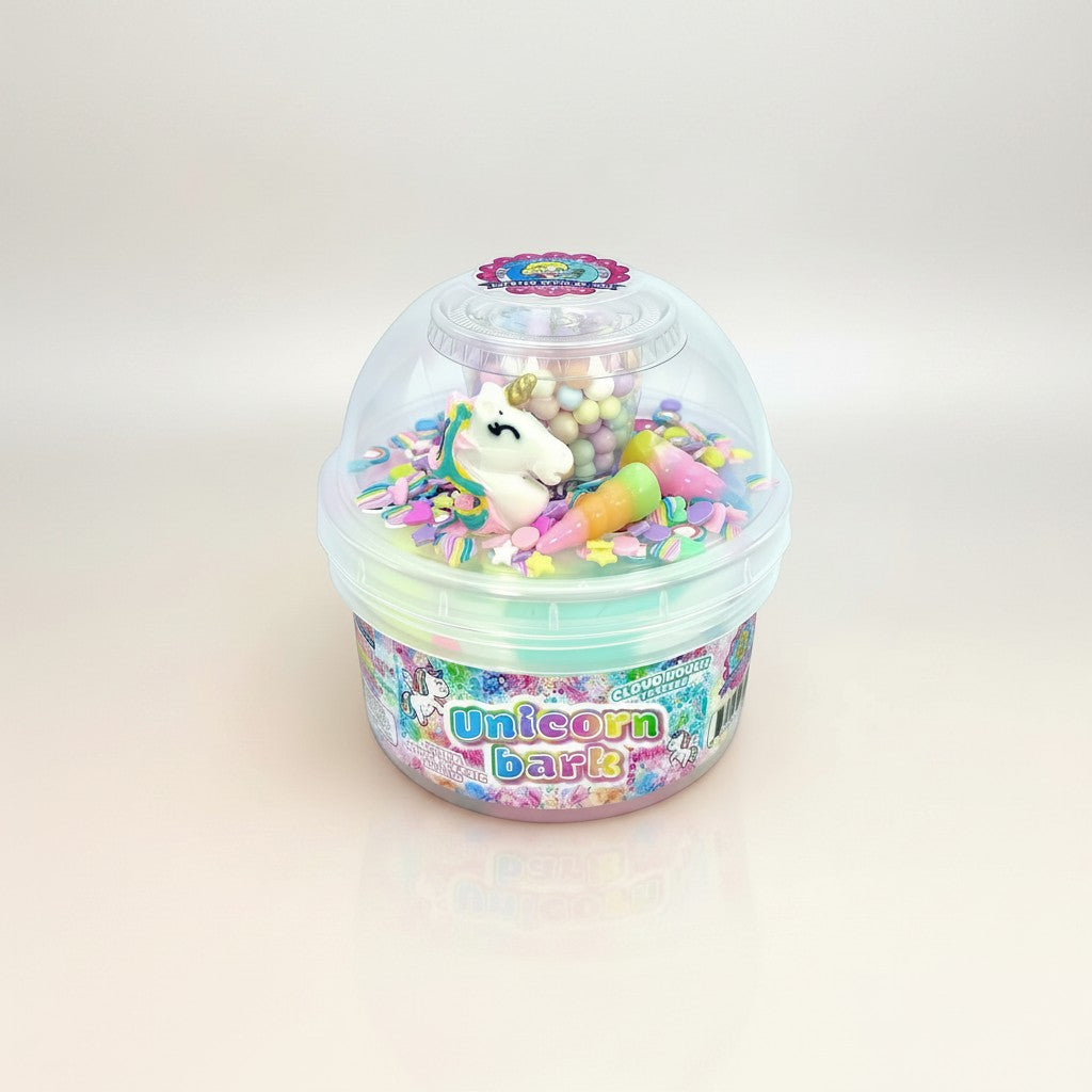 Doodlations Coffee Bar & Boutique Unicorn Bark cloud dough slime with pastel pink, blue, and lavender swirls, unicorn charm, sprinkles, and floam beads.