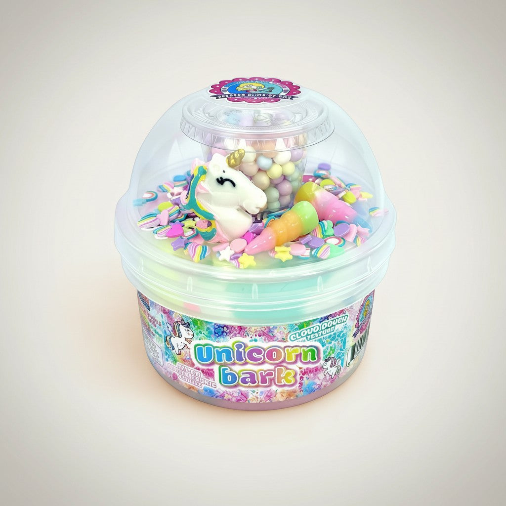 Doodlations Coffee Bar & Boutique Unicorn Bark slime with pastel pink, blue, and lavender swirls, unicorn charm, candy, and sprinkles.