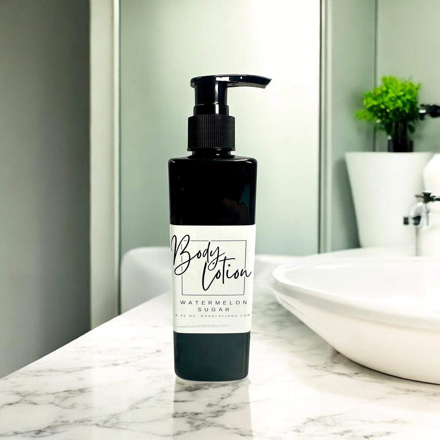 Doodlations Coffee Bar & Boutique Watermelon Sugar body lotion in a black pump bottle on a marble countertop.