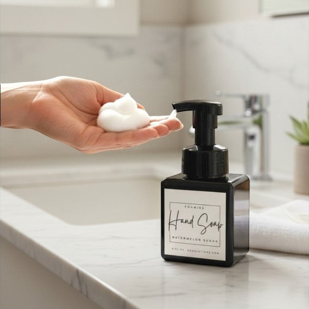 Doodlations Watermelon Sugar foaming hand soap in a black square bottle with a black pump dispenser. White label with black text.