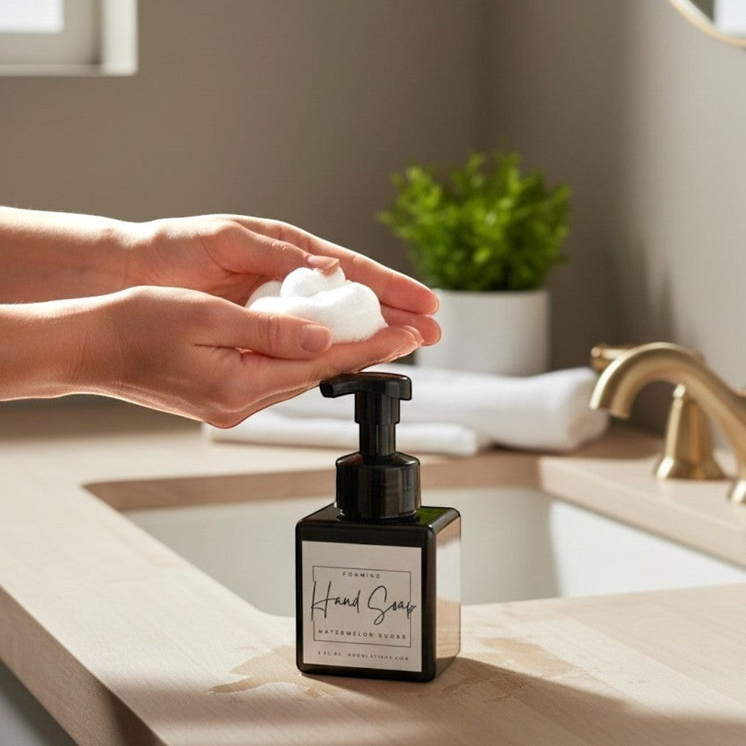 Doodlations Watermelon Sugar foaming hand soap in a black square bottle with a black pump dispenser. White label with black text.
