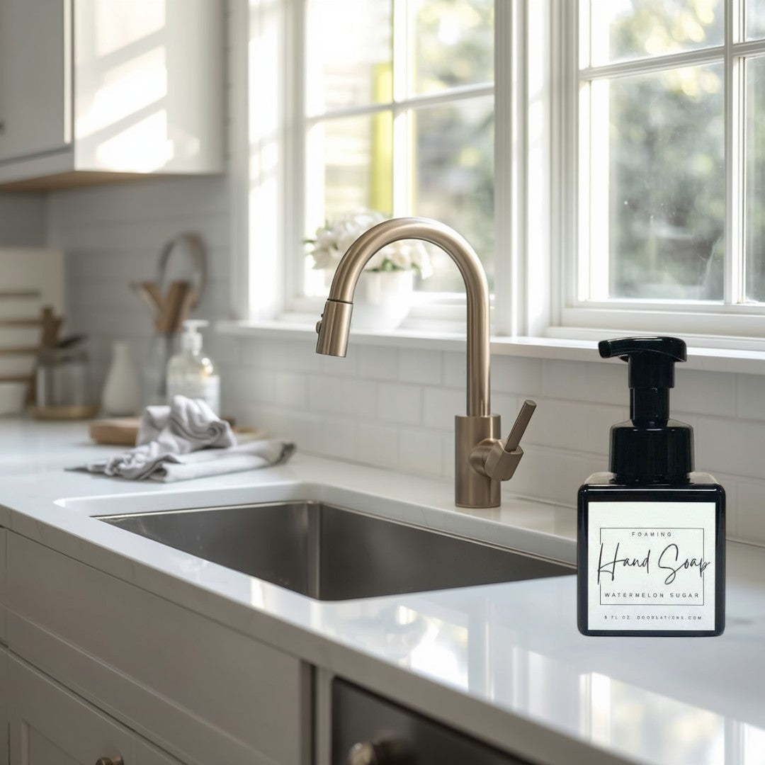 Doodlations Watermelon Sugar foaming hand soap in a square black bottle with a black pump dispenser. White label with black text.