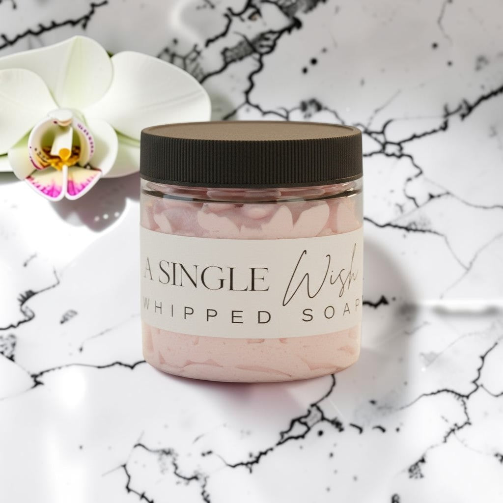 Doodlations Coffee Bar & Boutique Single Wish whipped soap in a clear jar with a black lid. Light pink whipped soap with grape seed oil.