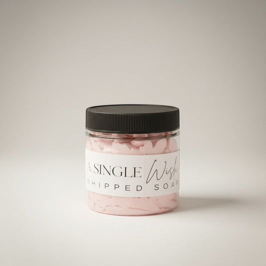 Doodlations Coffee Bar & Boutique Single Wish whipped soap in a clear jar with a black lid. Light pink, fluffy soap with grape seed oil.