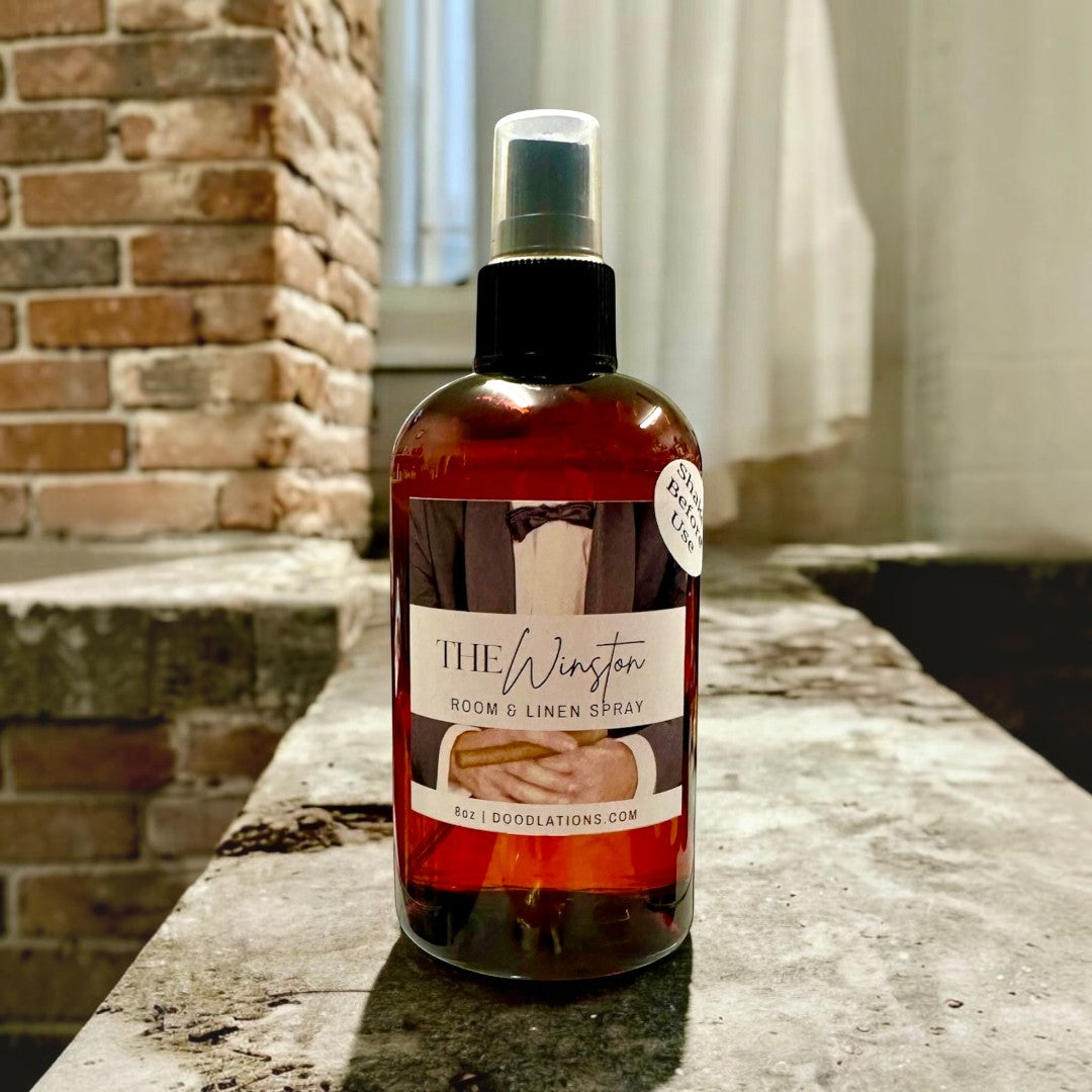 Doodlations Coffee Bar & Boutique The Winston Room & Linen Spray with tobacco, honey, amaretto, and oak notes.