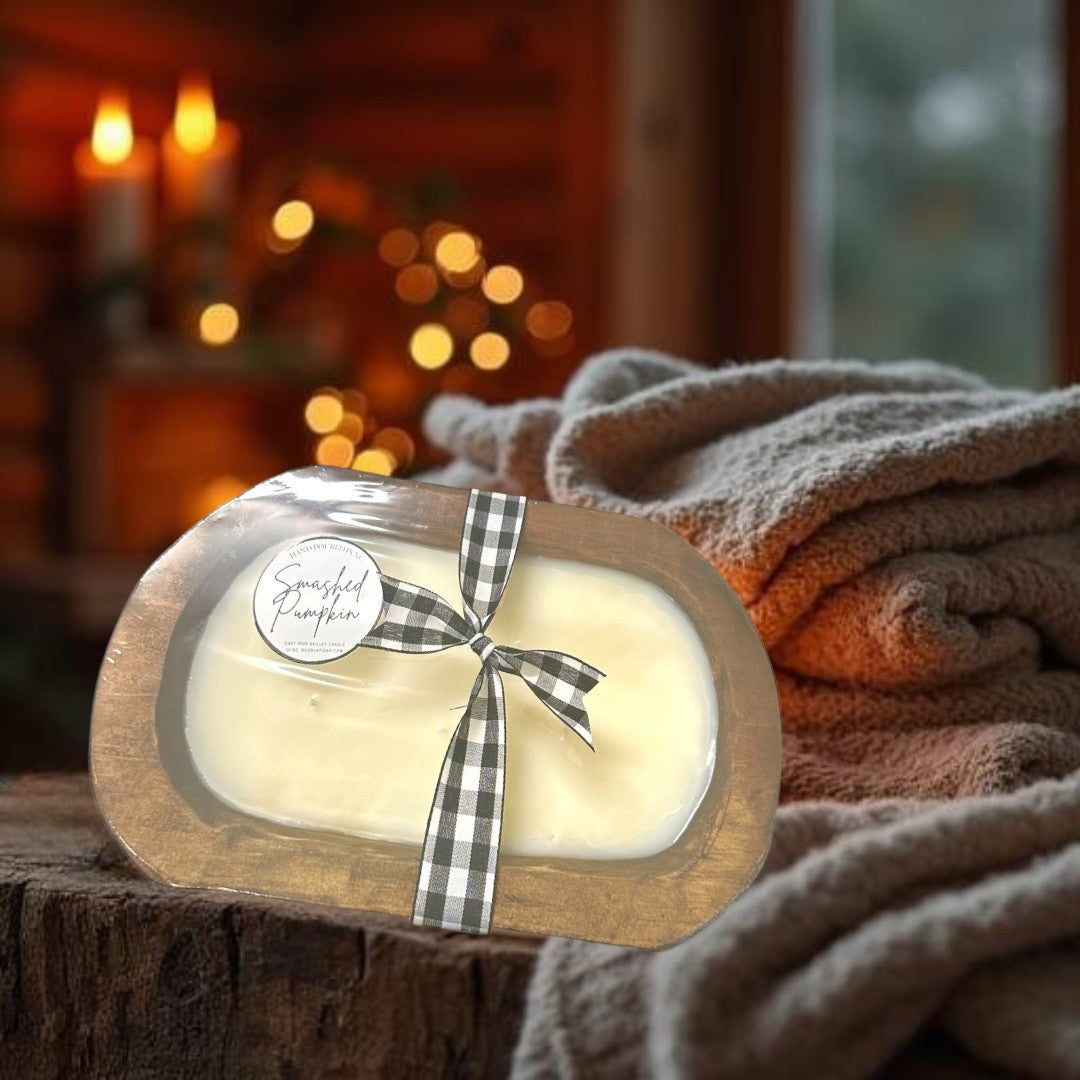 Doodlations Smashed Pumpkin wooden dough bowl candle with black and white buffalo check ribbon. Cream wax.