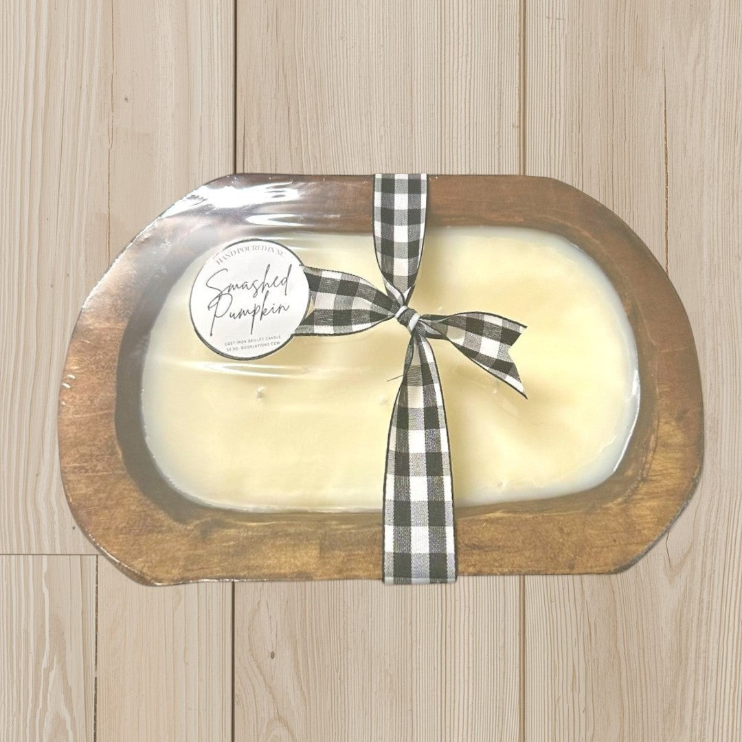 Doodlations Smashed Pumpkin wooden dough bowl candle with black and white buffalo check ribbon. Cream wax.