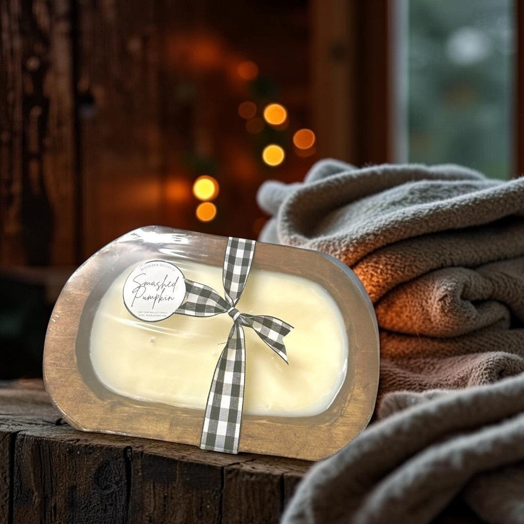 Doodlations Smashed Pumpkin wooden dough bowl candle with black and white buffalo check ribbon. Cream wax.