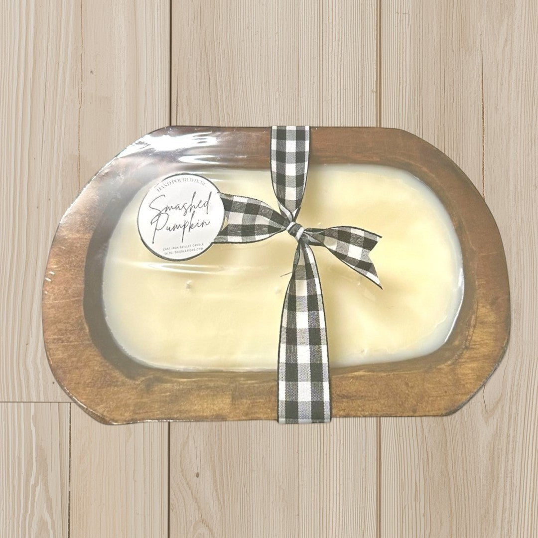 Doodlations Smashed Pumpkin wooden dough bowl candle with black and white buffalo check ribbon. Cream wax.