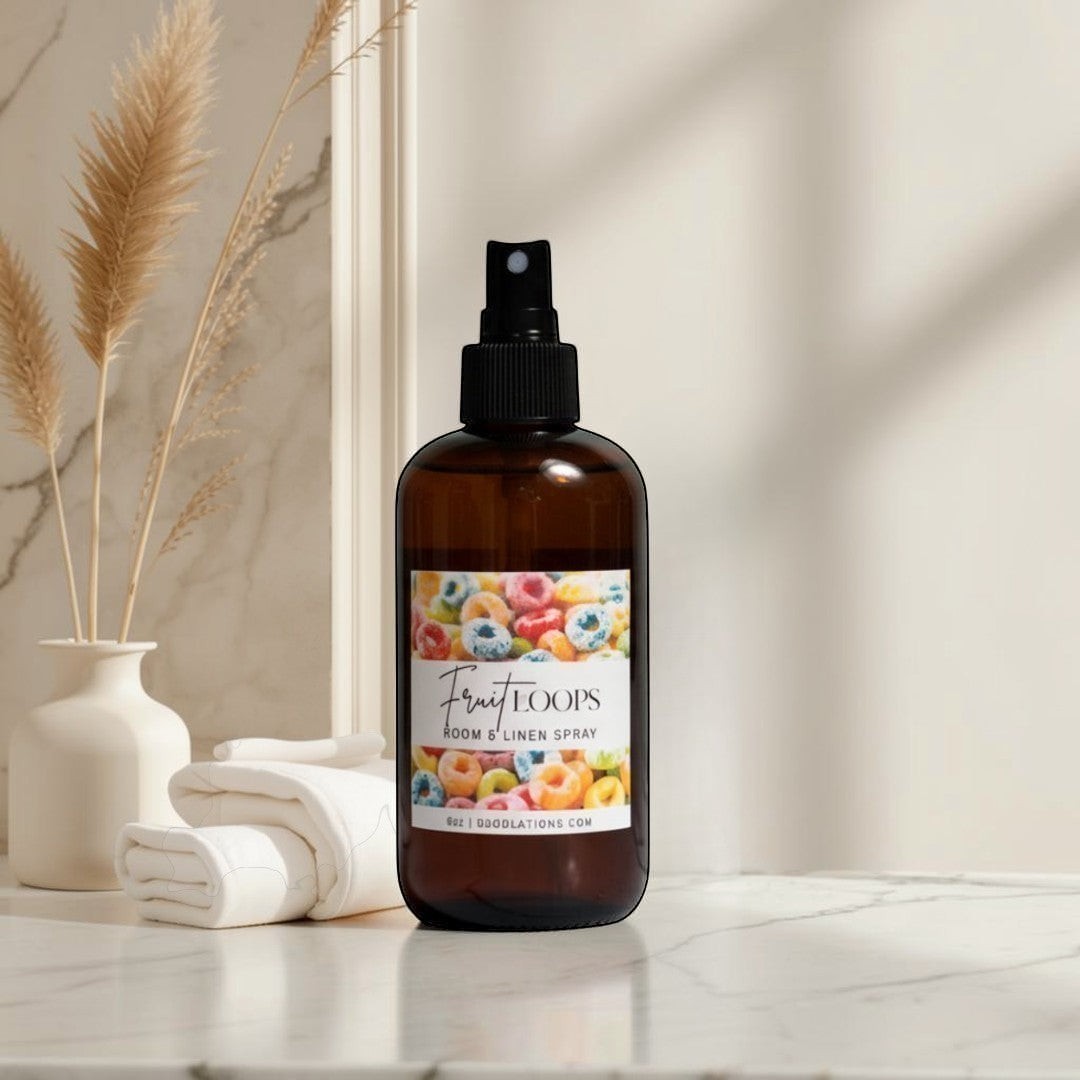 Doodlation's Coffee and Boutique Fruit Loops room and linen spray in an amber bottle with a colorful cereal label.
