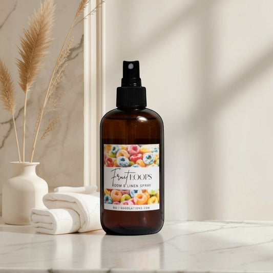 Doodlation's Coffee and Boutique Fruit Loops room and linen spray in an amber bottle with a colorful cereal label.
