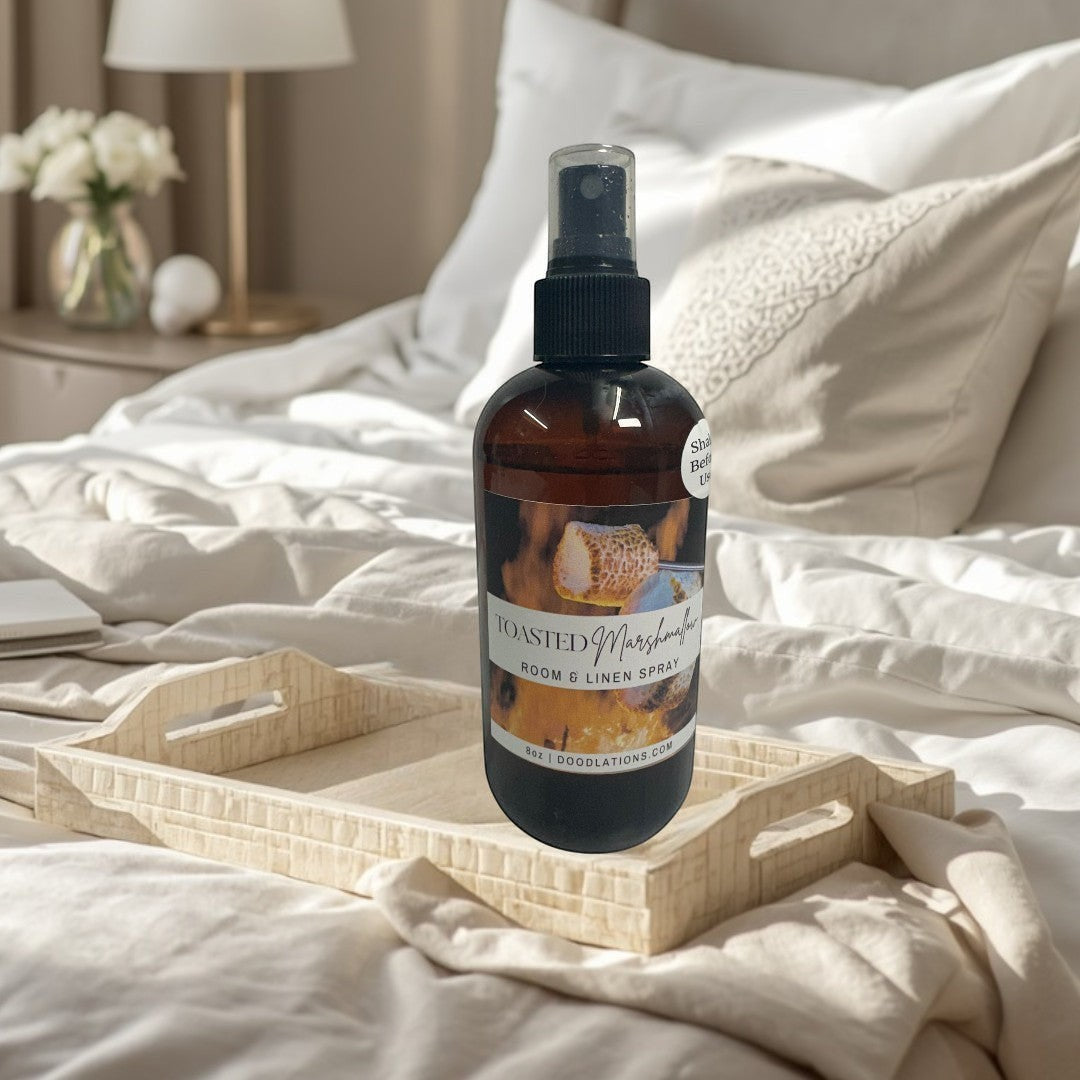 Coffee Bar & Boutique Toasted Marshmallow room and linen spray in amber bottle with black spray top.