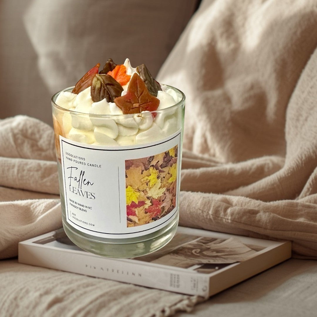 Fallen Leaves hand-poured candle with realistic wax leaves and autumn scent.