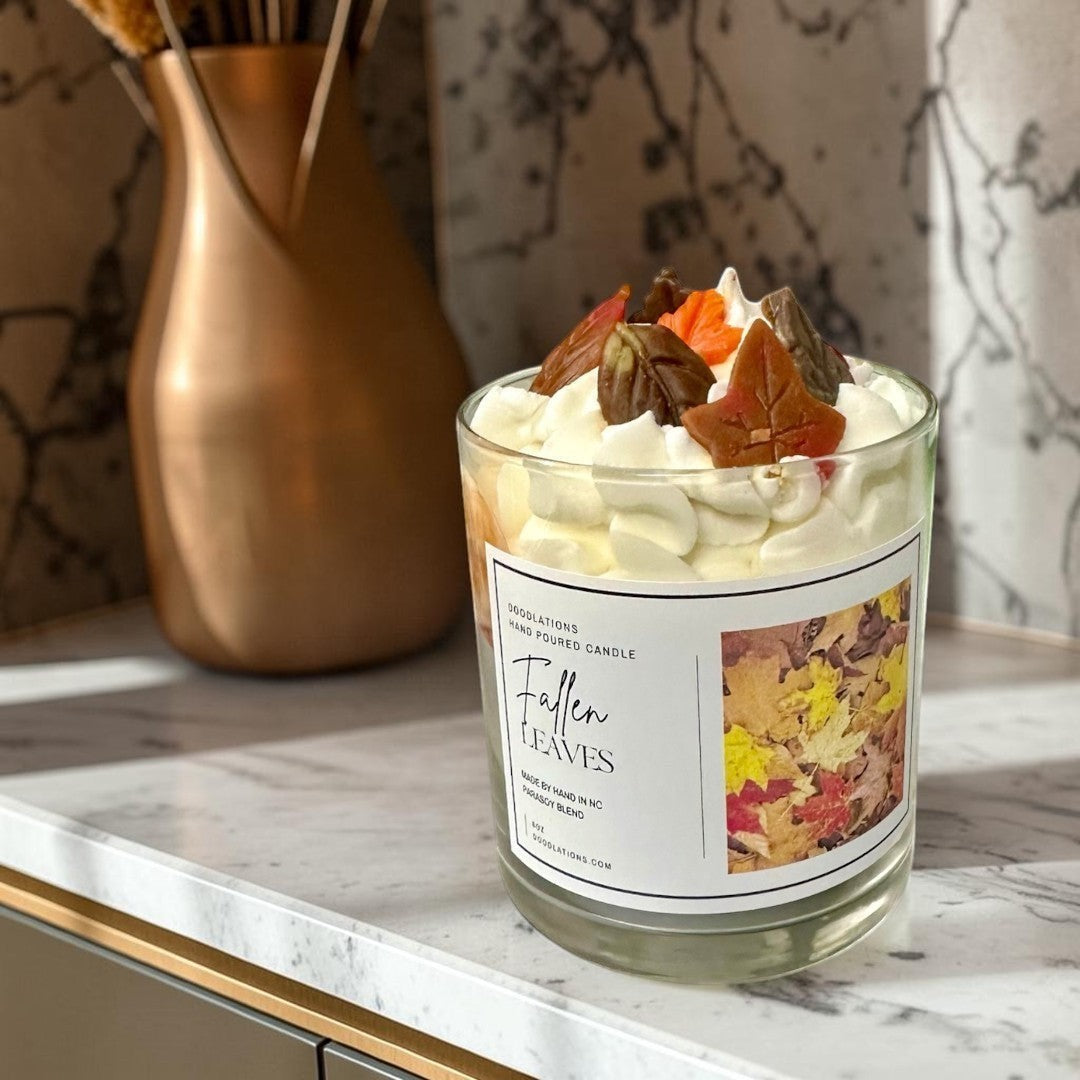 Fallen Leaves hand-poured candle with realistic wax leaves and autumn scent.