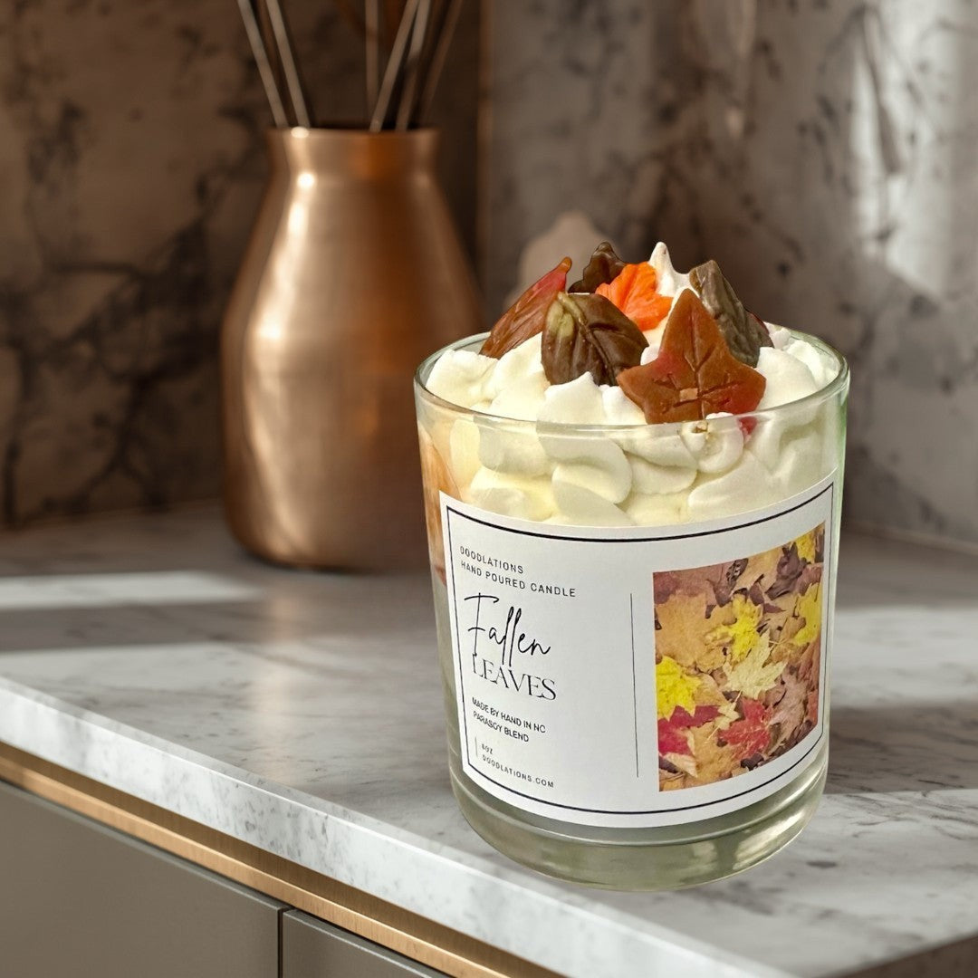 Fallen Leaves hand-poured candle with realistic wax leaves and autumn scent.