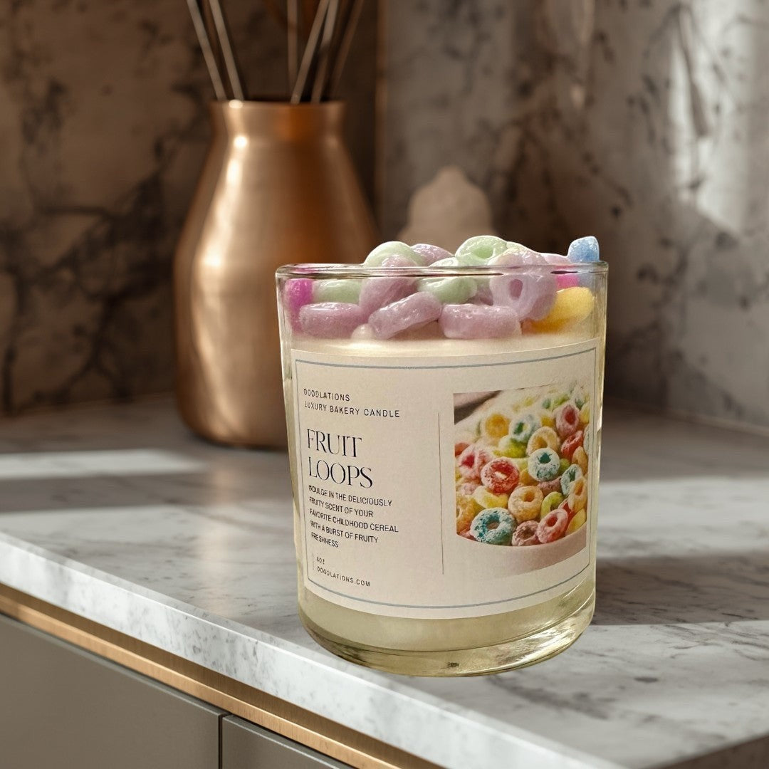 Fruit Loops luxury bakery candle in a glass jar, topped with colorful cereal pieces. Fruity scent.