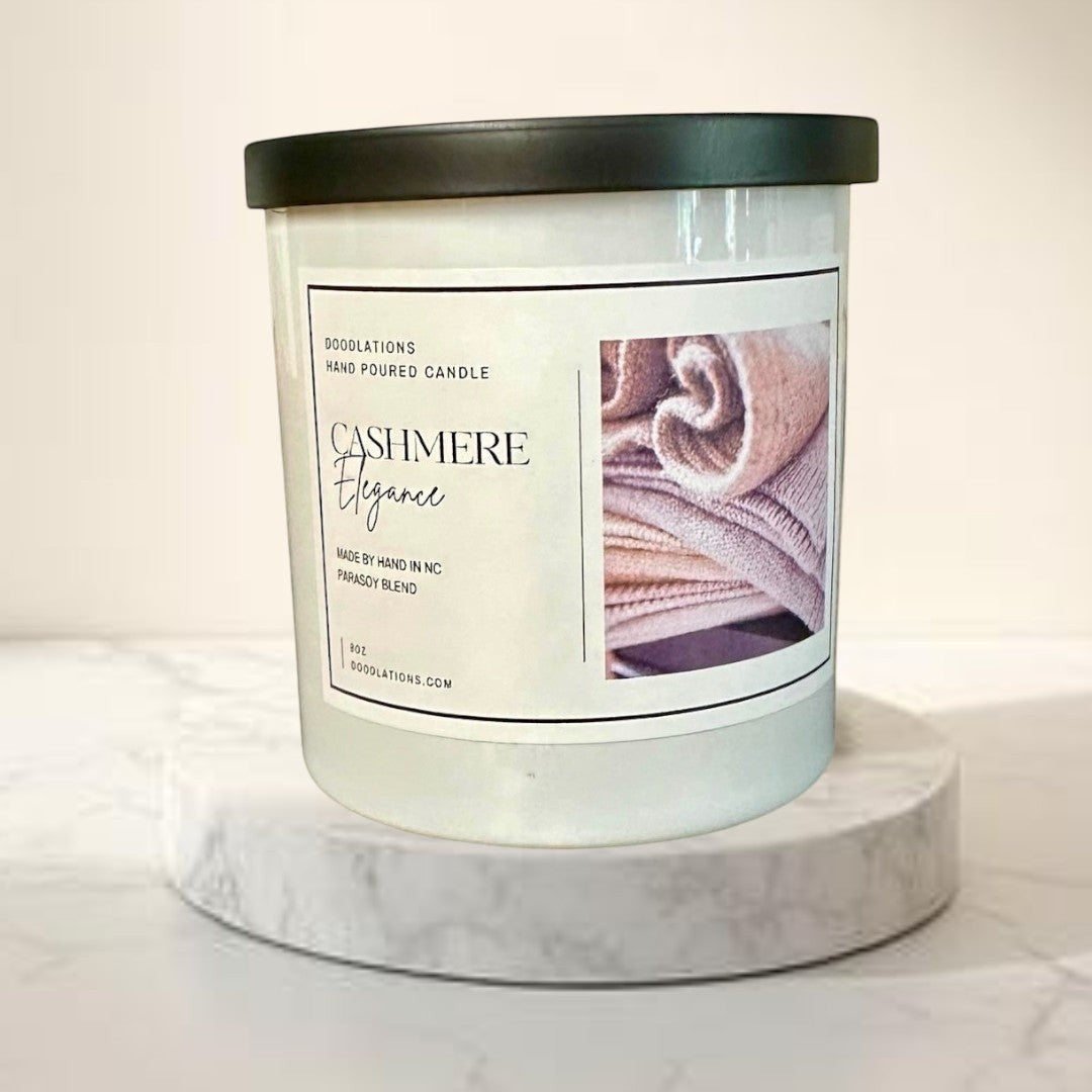 Cashmere Elegance hand-poured candle with a parasoy blend, featuring notes of amber, sugar, vanilla, plum, and cherry