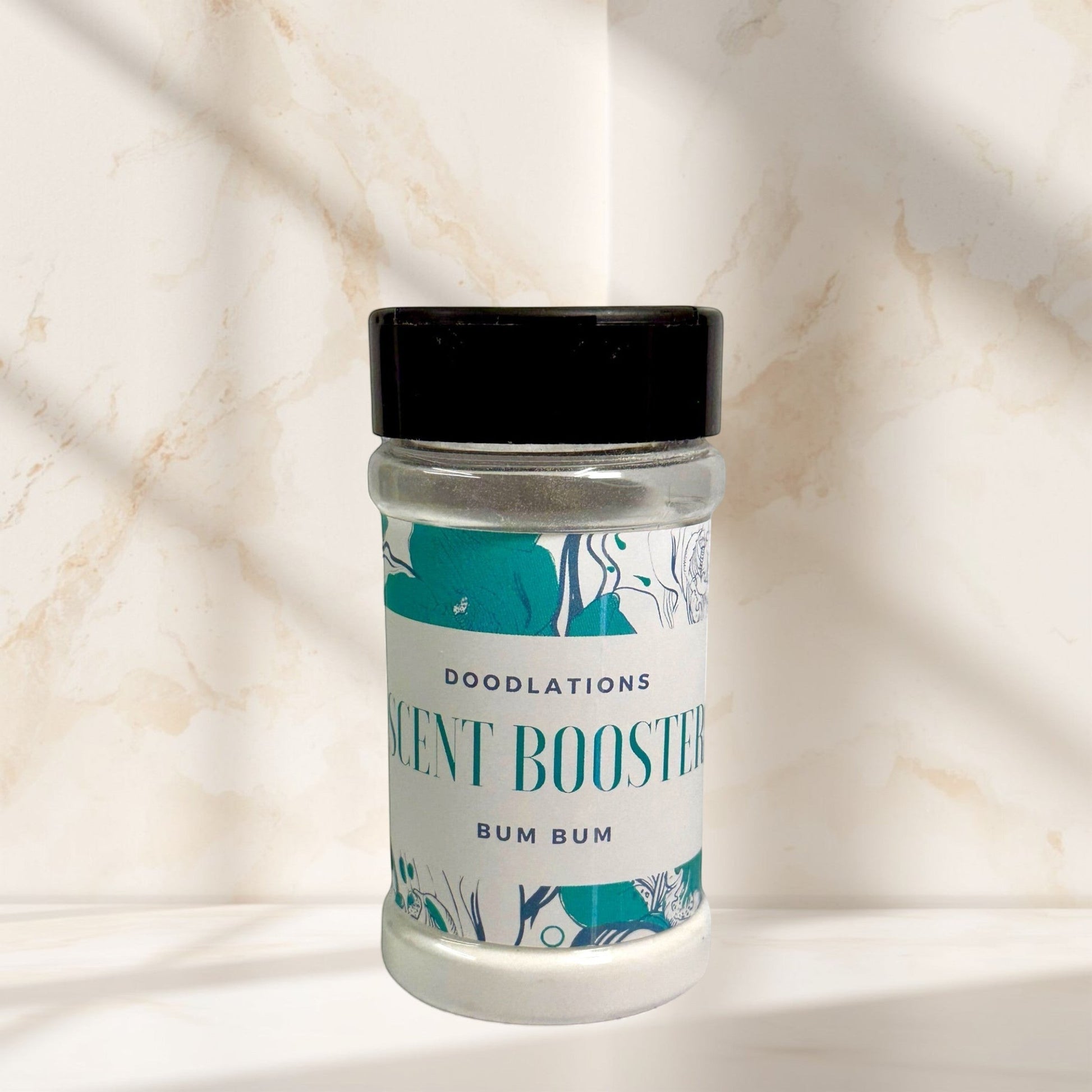 Bum Bum laundry scent booster in a clear jar with a black lid. Tropical scent.